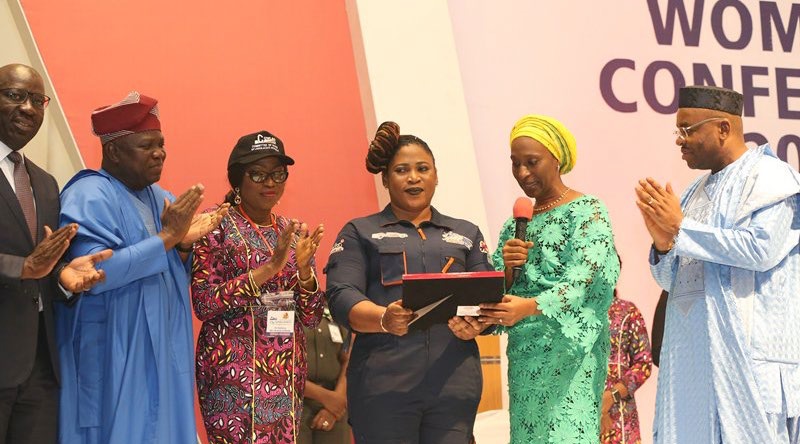 Sandra Aguebor Receiving An Award From Her Excellency, Dolapo Osinbajo And Ex-Lagos State Governor, Akinwunmi Ambode