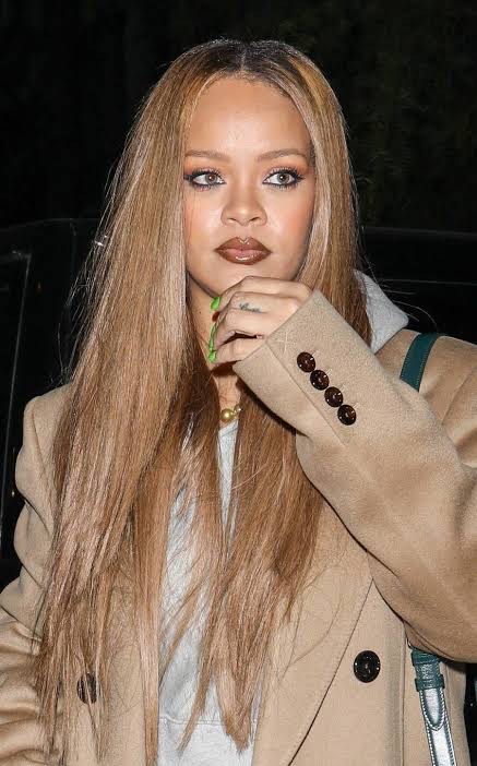 Rihanna Stuns in Honey Blonde Curls, Continues to Redefine Fashion Icon  Status - TheWill Downtown